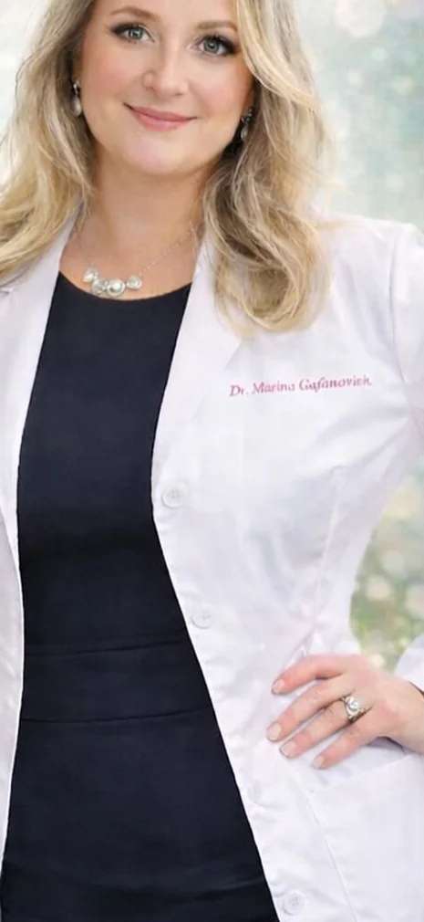 Dr. Marina Gafanovich, MD, primary care doctor in a white coat